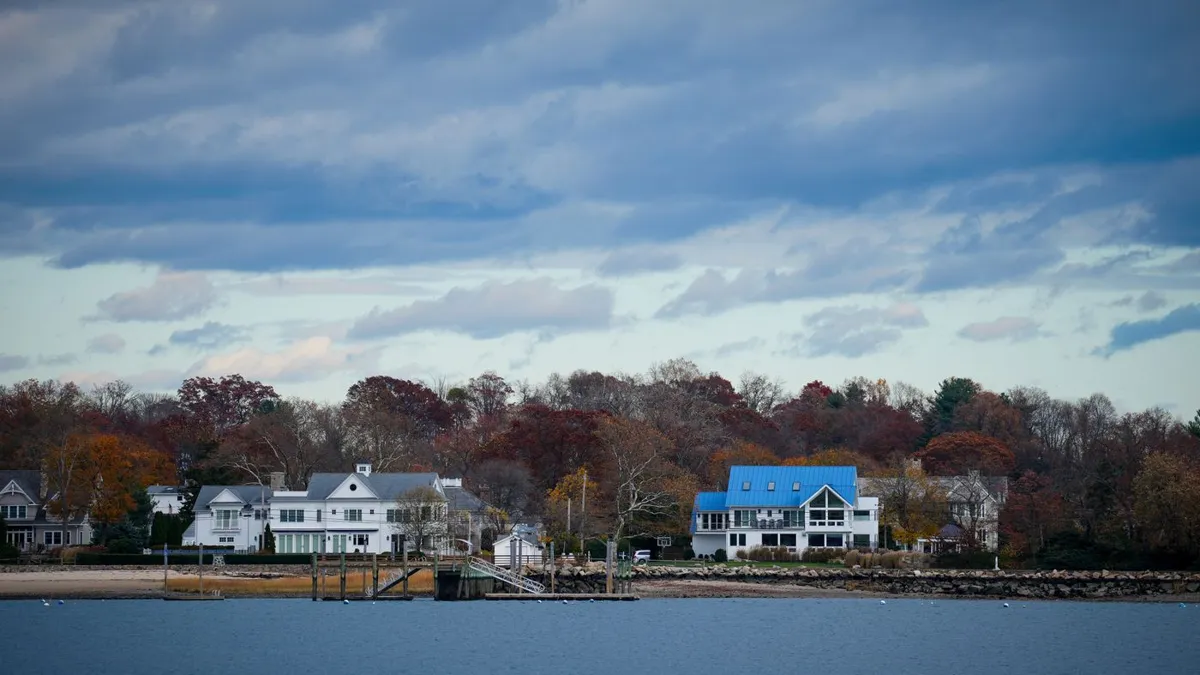 Waterfront homes with autumn trees in Stamford, Connecticut, where SEO for roofers helps local contractors win jobs